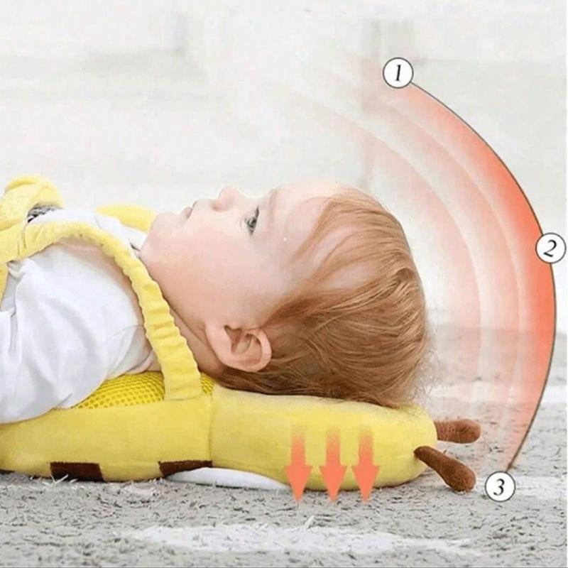 baby lying on bee head protection pillow showing fall impact absorption